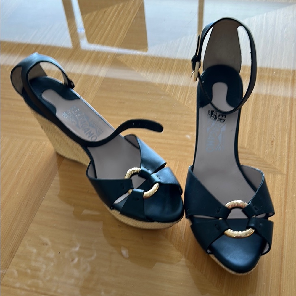 Salvatore Ferragamo Black Wedge Sandals
3 5/8 high back and 1 3/4 front
